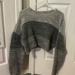 Cropped greyscale sweater.